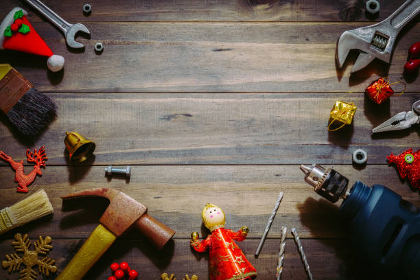 istock Merry christmas and Happy New year with handy tools  background concept, Used old rusty constructor tools with Christmas decoration on wood 884019624