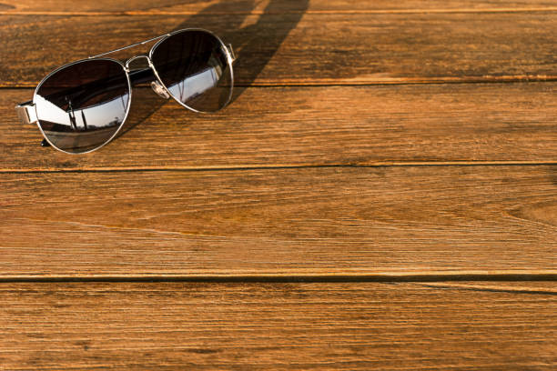 istock The sunglasses sliver frame is on the wood table 884020024