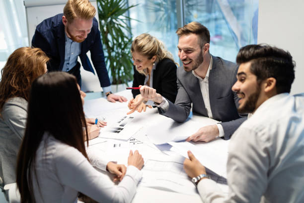 istock Team of architects working together on project 884028088