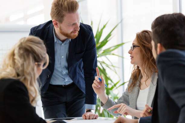 istock Team of architects working together on project 884028782