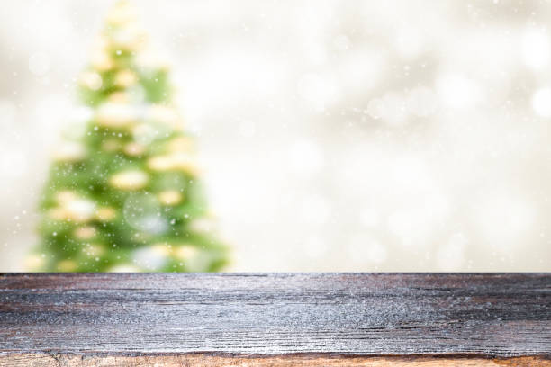istock Wood table top on white bokeh abstract background 884029580