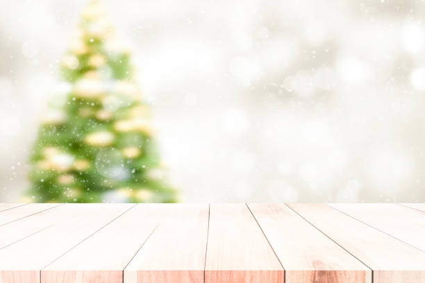 istock Wood table top on white bokeh abstract background 884029590