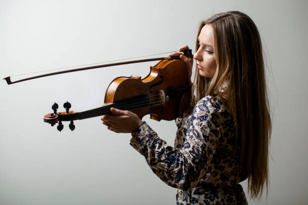 istock girl and the violin 884038500