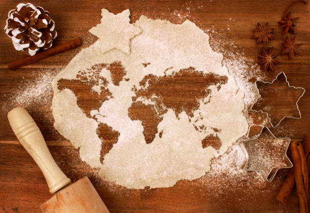 cookie dough cut as the shape of the world (series) - world cuisines imagens e fotografias de stock