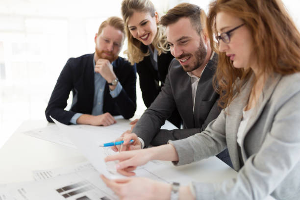 istock Team of architects working together on project 884039410