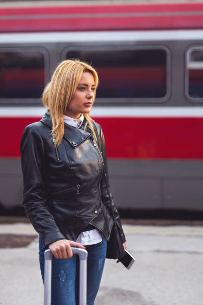 istock Tourist waiting train on station 884042718