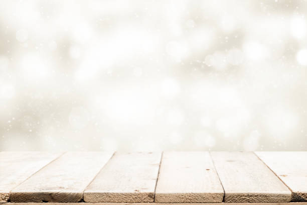 istock Wood table top on white bokeh abstract background 884047888
