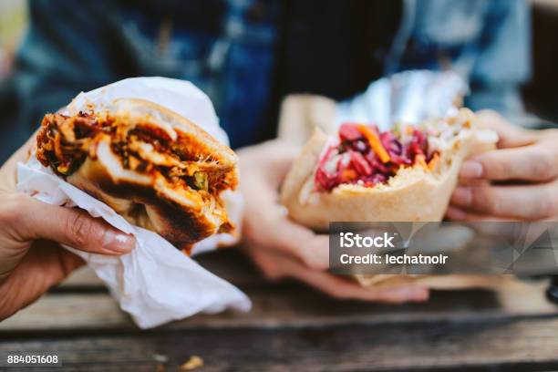 Close Up Of A Texas Pulled Pork Bbq Burger And A Falafel Outdoors Stock Photo - Download Image Now