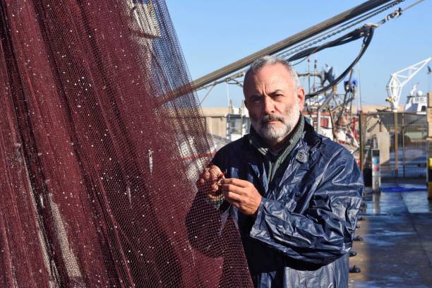 fisherman - fishing nautical vessel small men imagens e fotografias de stock