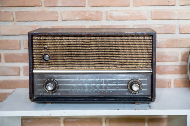 istock Obsolete radio on wooden, brick wall background 884053050