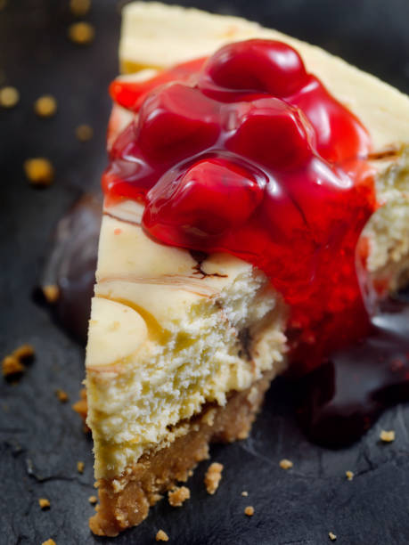 istock Chocolate Swirl Cheesecake with Cherry Topping 884055400