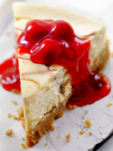 istock Chocolate Swirl Cheesecake with Cherry Topping 884055744