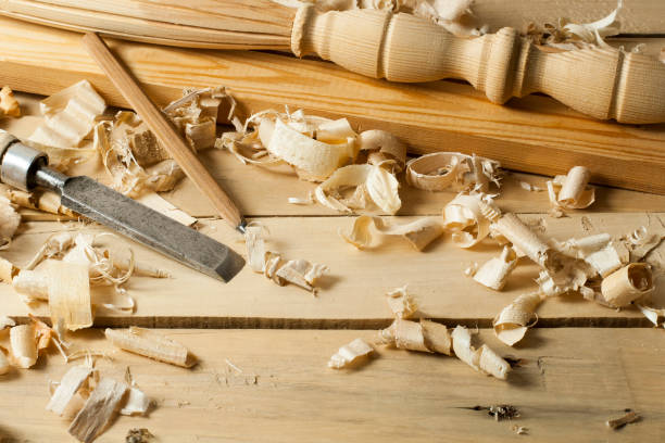 istock Carpentry concept.Joiner carpenter workplace. Construction tools on wooden table with sawdust. Copy space for text. 884058520