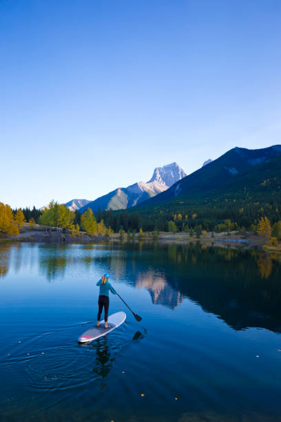 istock Stand Up Paddleboard Girl 884062386