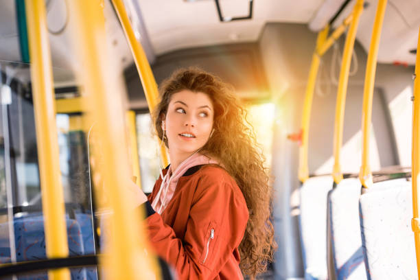 istock smiling girl in city bus 884066974