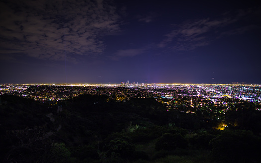 The City of Los Angeles after dark, taken from up in the Santa Monica Mountains, with the DTLA skyline in the center of the frame.