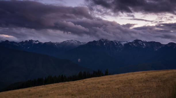 istock Purple Clouds Over Olympic Mountains at Twilight 884069920