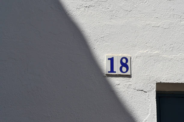 istock Ancient wall with ceramic number of the house 884076450