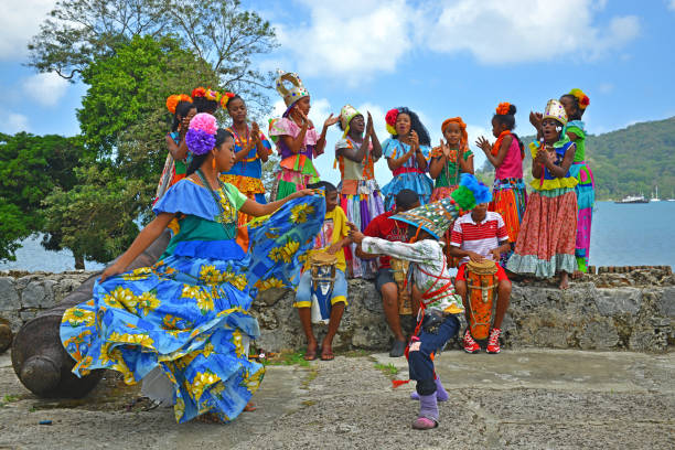 Panama Congo Dance in Portobelo A group of young Panamenians performing the Congo dance in one of the Spanish fortresses (hence the cannons) of Portobelo by the Caribbean Sea, Panama, Central America. beautiful traditional indian girl stock pictures, royalty-free photos & images