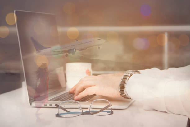 istock Double Exposure of Businessman use Computer Tablet with Airplane 884082530