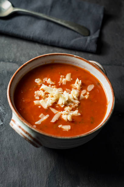 istock Tomato and Basil soup topped with grated cheese. 884082930