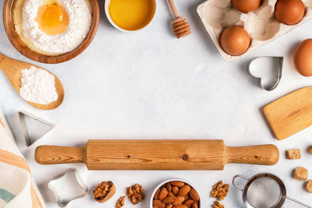 istock Ingredients for baking  - flour, wooden spoon, rolling pin, eggs. 884086250