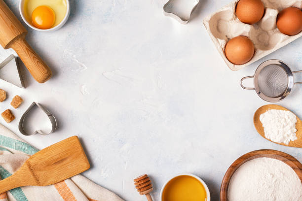 istock Ingredients for baking  - flour, wooden spoon, rolling pin, eggs. 884086298