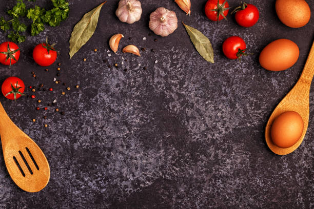 istock Ingredients for cooking on dark concrete background. 884086370
