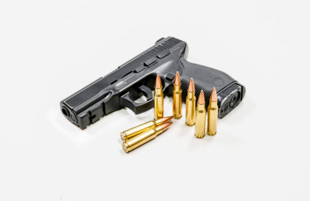 istock Black pistol and cartridges 884086768