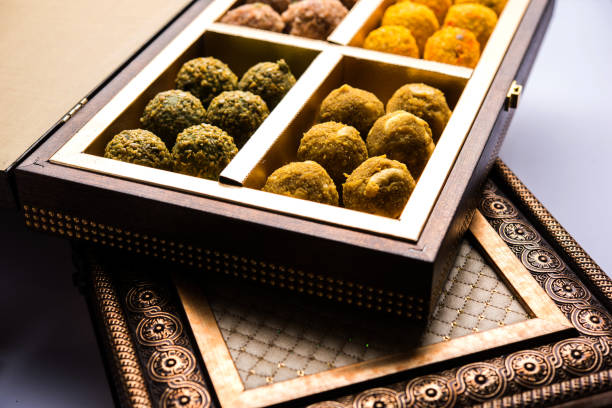 energy laddu made using saffron, oatmeal, almond, cashew, pistachio and fig Dates oatmeal balls / No cook energy bites / saffron, pistachio, gum, cashew and other dry fruit laddu including dink or dinkache ladoo or edible gum ladu mithai stock pictures, royalty-free photos & images