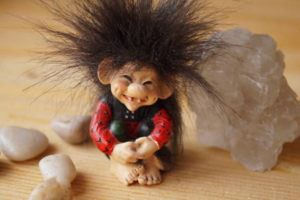 istock A troll cute with a salt crystal and stones 884099582