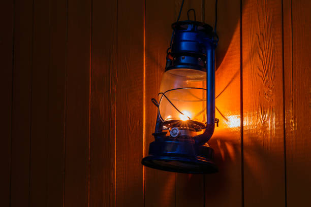 istock old kerosene lantern hanging on the yellow wooden wall 884105762