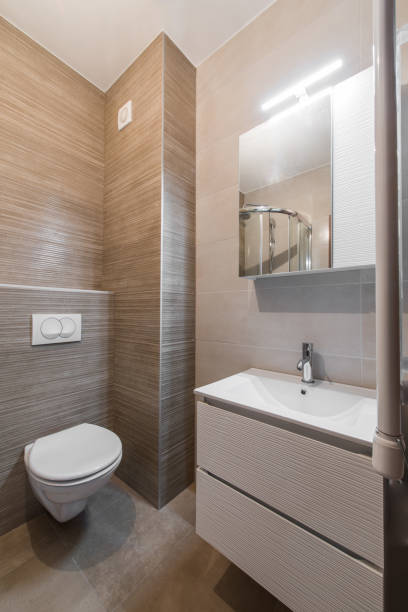 istock Toilet and washbasin in modern bathroom interior 884106098