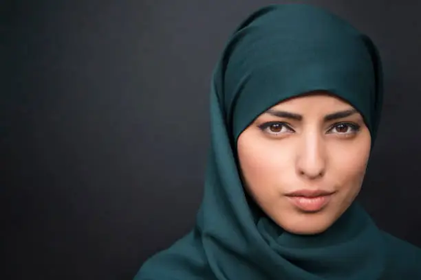 Portrait of a beautiful muslim woman wearing hijab.
