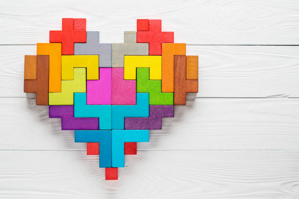 Heart made of colorful wooden shapes, top view, flat lay. Heart made of colorful wooden shapes, top view, flat lay. Health background concept. heart internal organ photos stock pictures, royalty-free photos & images