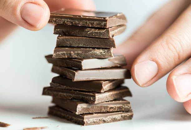Woman stacking chocolate chip.