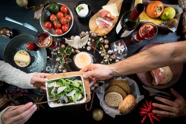 istock festive christmas thanksgiving dinner party food drinks hands 884116224
