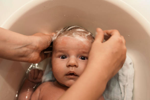 istock Mum and baby in a bathroom 884116340