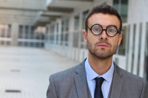 istock Businessman wearing thick glasses isolated 884116574
