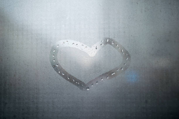 istock Heart sign on condensed glass 884128114