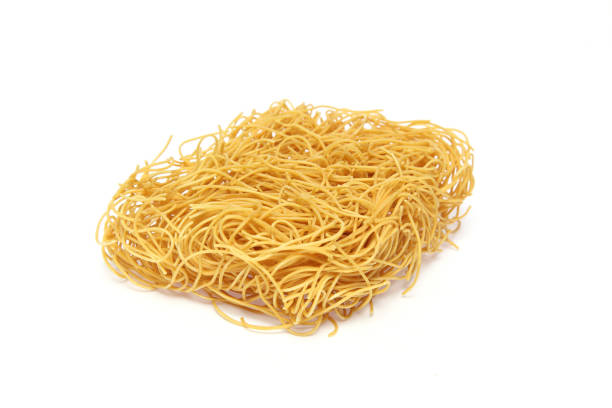 istock Crispy fried noodles in a white background 884131486
