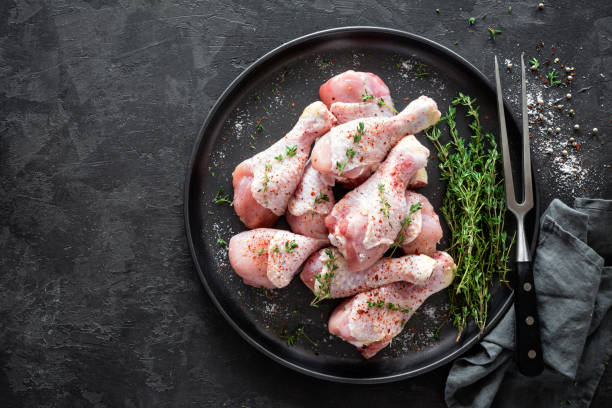 istock Raw marinated chicken meat, chicken legs 884146050