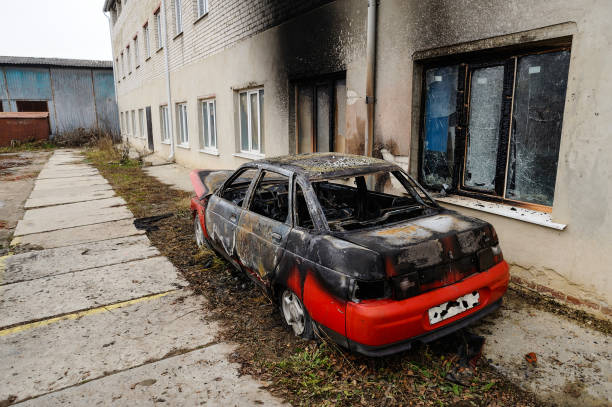 istock Burnt red car after fire accident 884146066