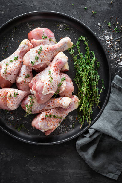 istock Raw marinated chicken meat, chicken legs 884148234