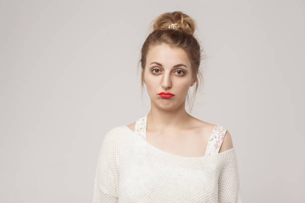 istock Unhappy lady puffed lips and looking sadness at camera. 884148432