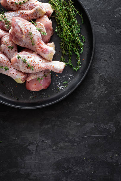 istock Raw marinated chicken meat, chicken legs 884148504