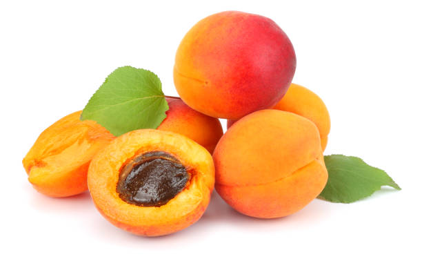 istock apricot fruits with green leaf isolated on white background Clipping Path 884151014