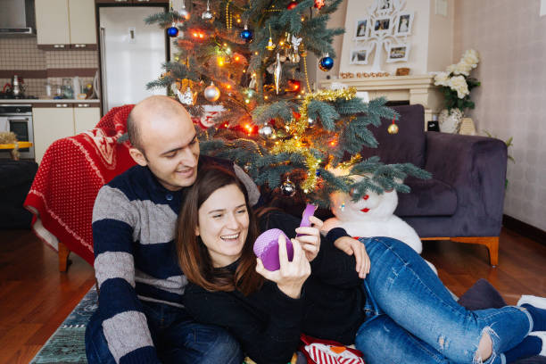 istock Man giving a Christmas present to his girlfriend 884151672