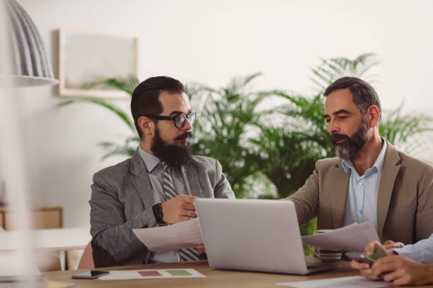 istock Businessmen Working Together In The Office 884179110