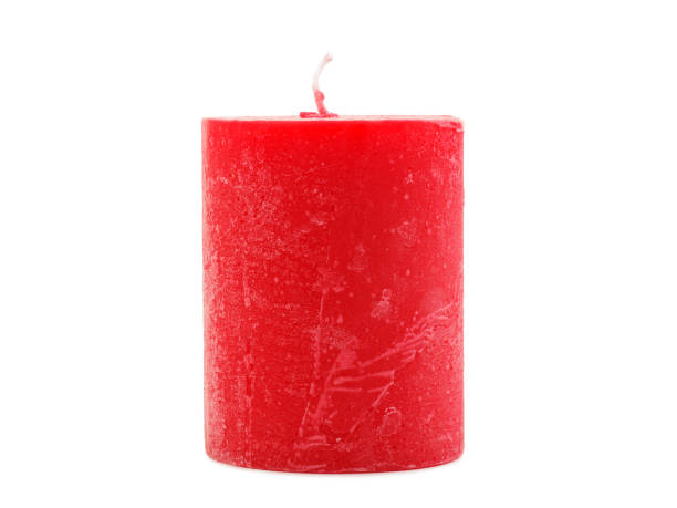 istock Red wax candle with a wick on a white background 884194816